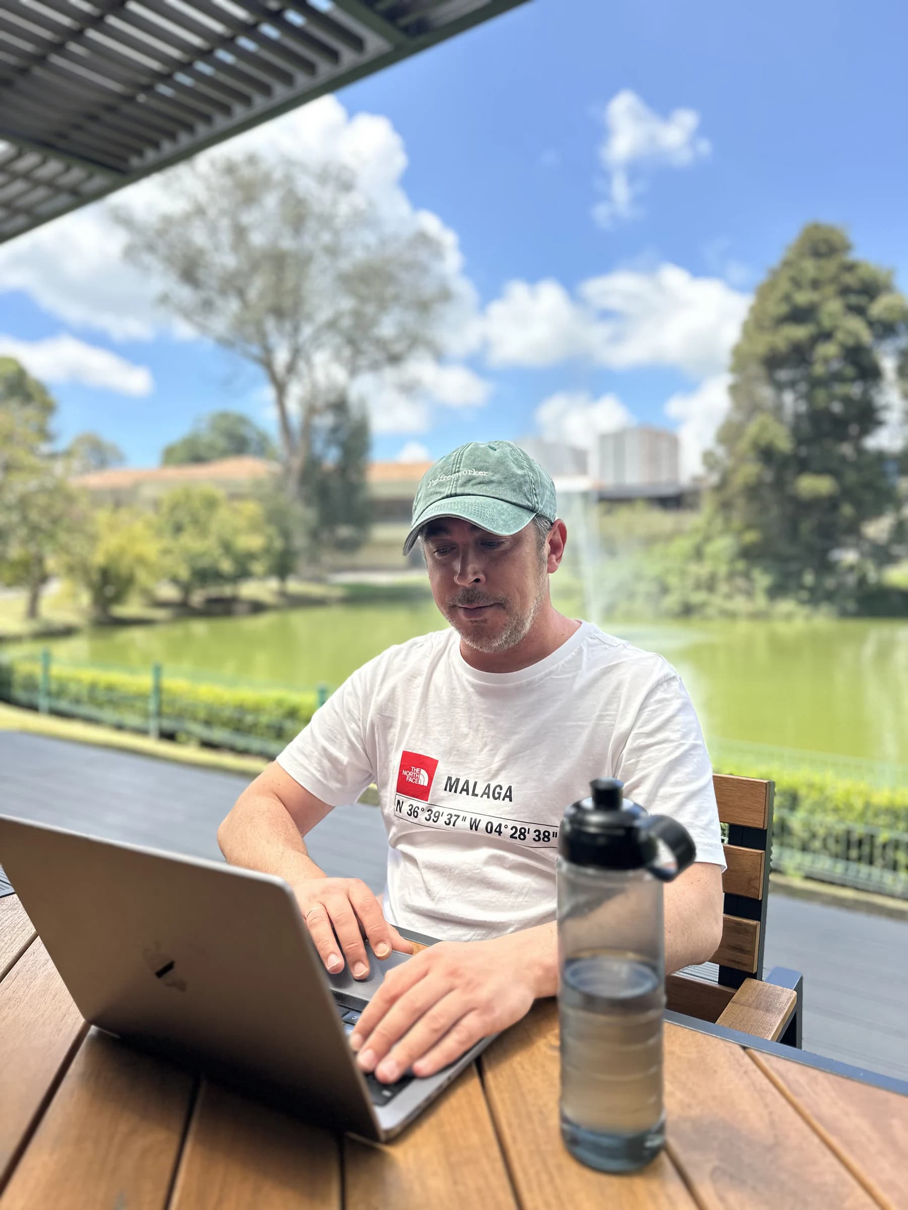 David Oliva working on his laptop in a coworking space