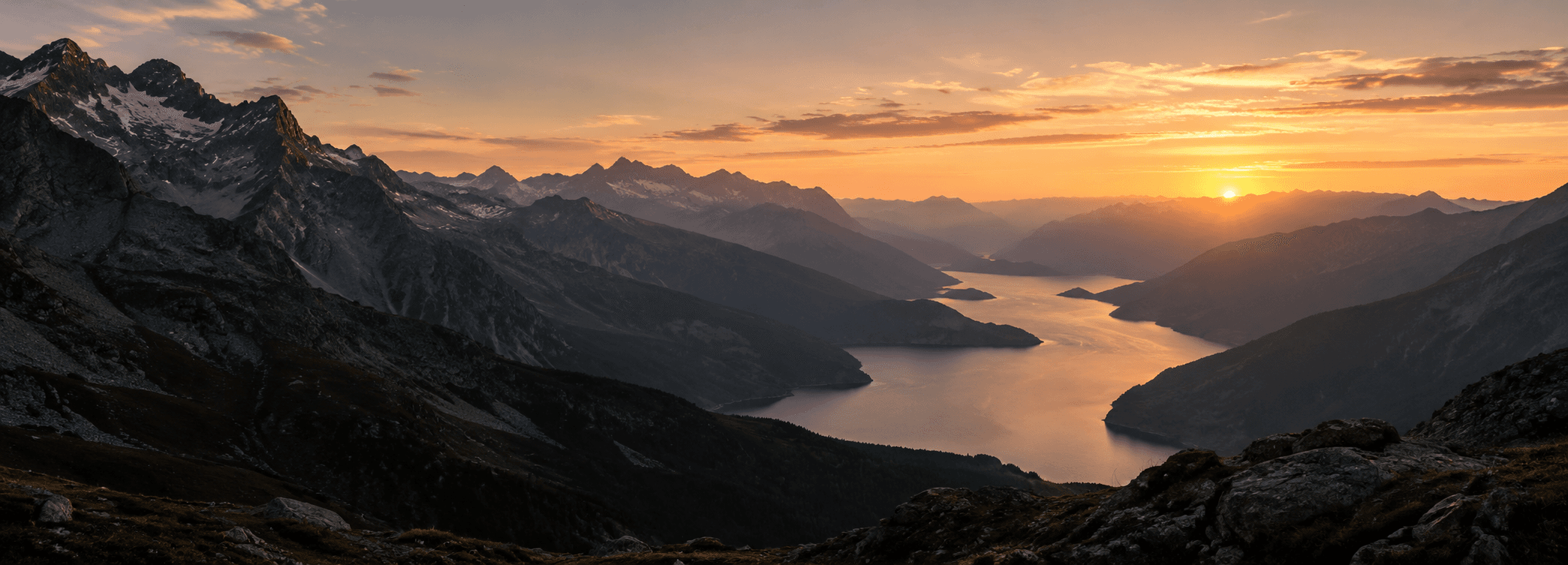 Mountain valley and lake at golden hour